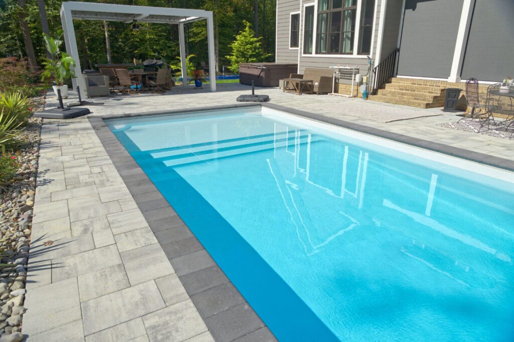 Modern poolside with clear blue water