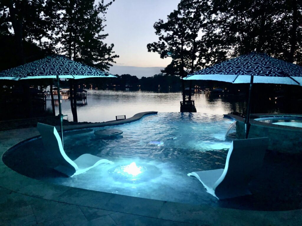 Illuminated pool by serene lake