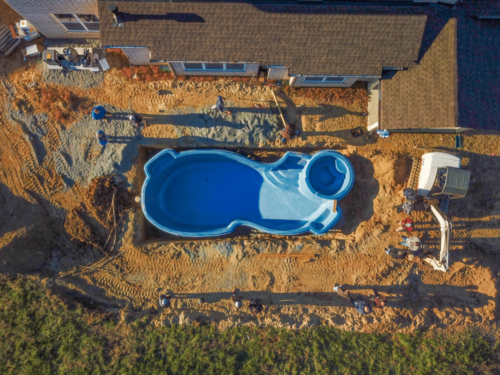 Construction of a fiberglass swimming pool site