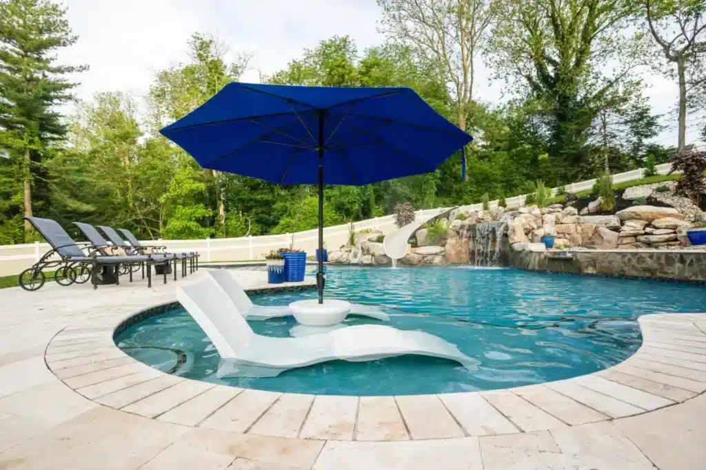 Pool with umbrella and lounge chair